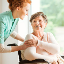 caregiver and old woman talking